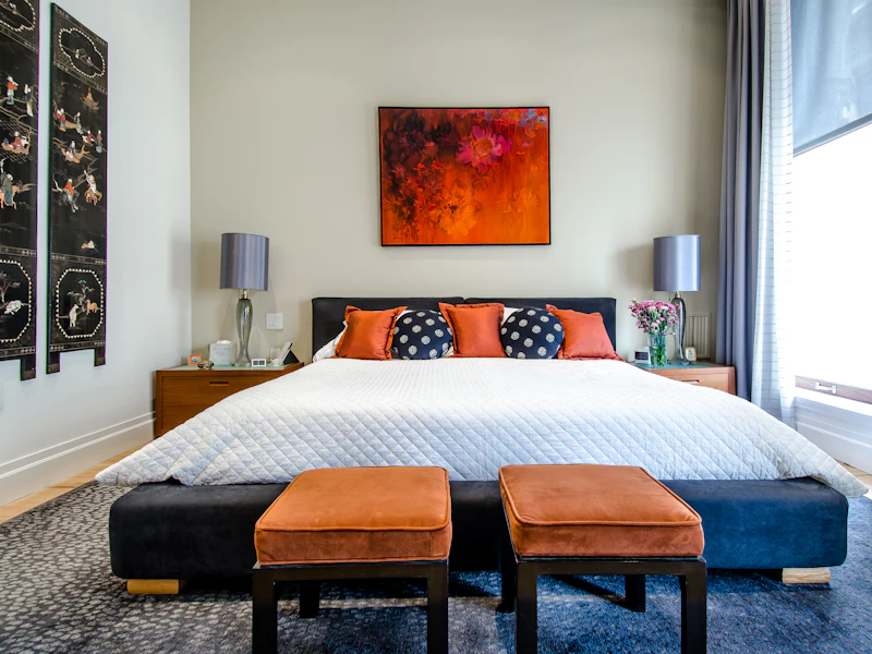 Freshly made bed in a guest bedroom